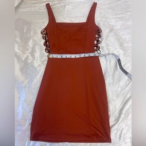 Mini red-orange party dress with side cutouts
